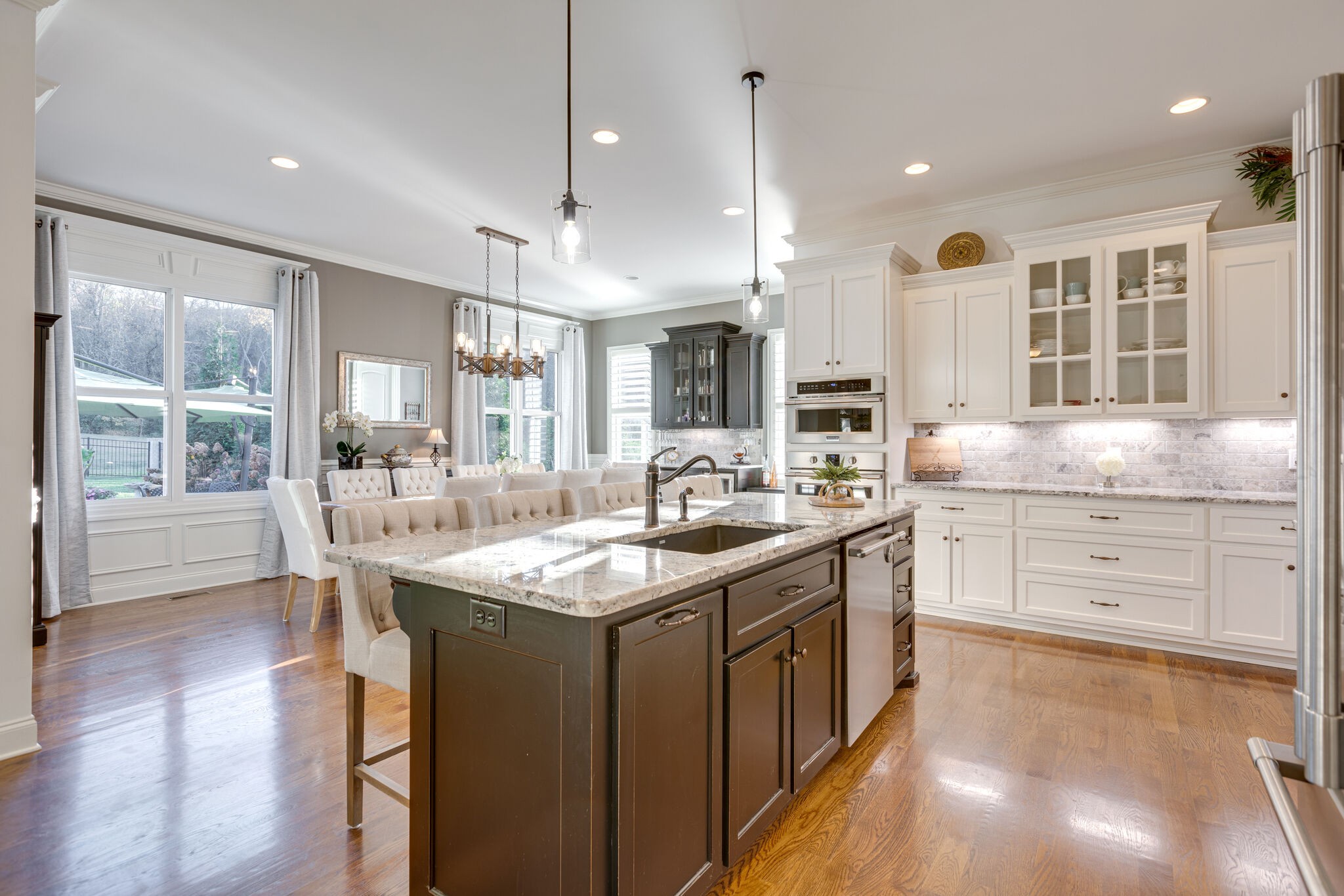 3692 Ronstadt Road Thompson's Station, TN 37179 - Photo 22 of 63 a kitchen with counter top space sink and living room view