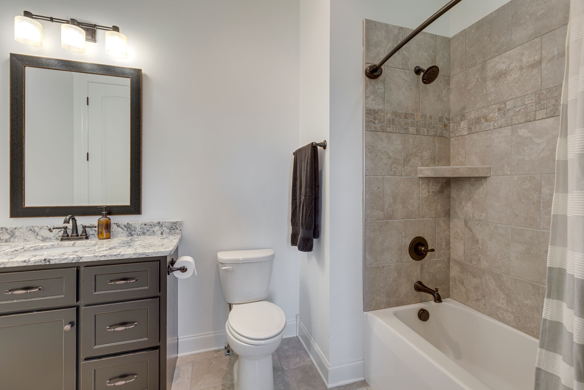 3692 Ronstadt Road Thompson's Station, TN 37179 - Photo 30 of 63 a bathroom with a granite countertop sink toilet and shower