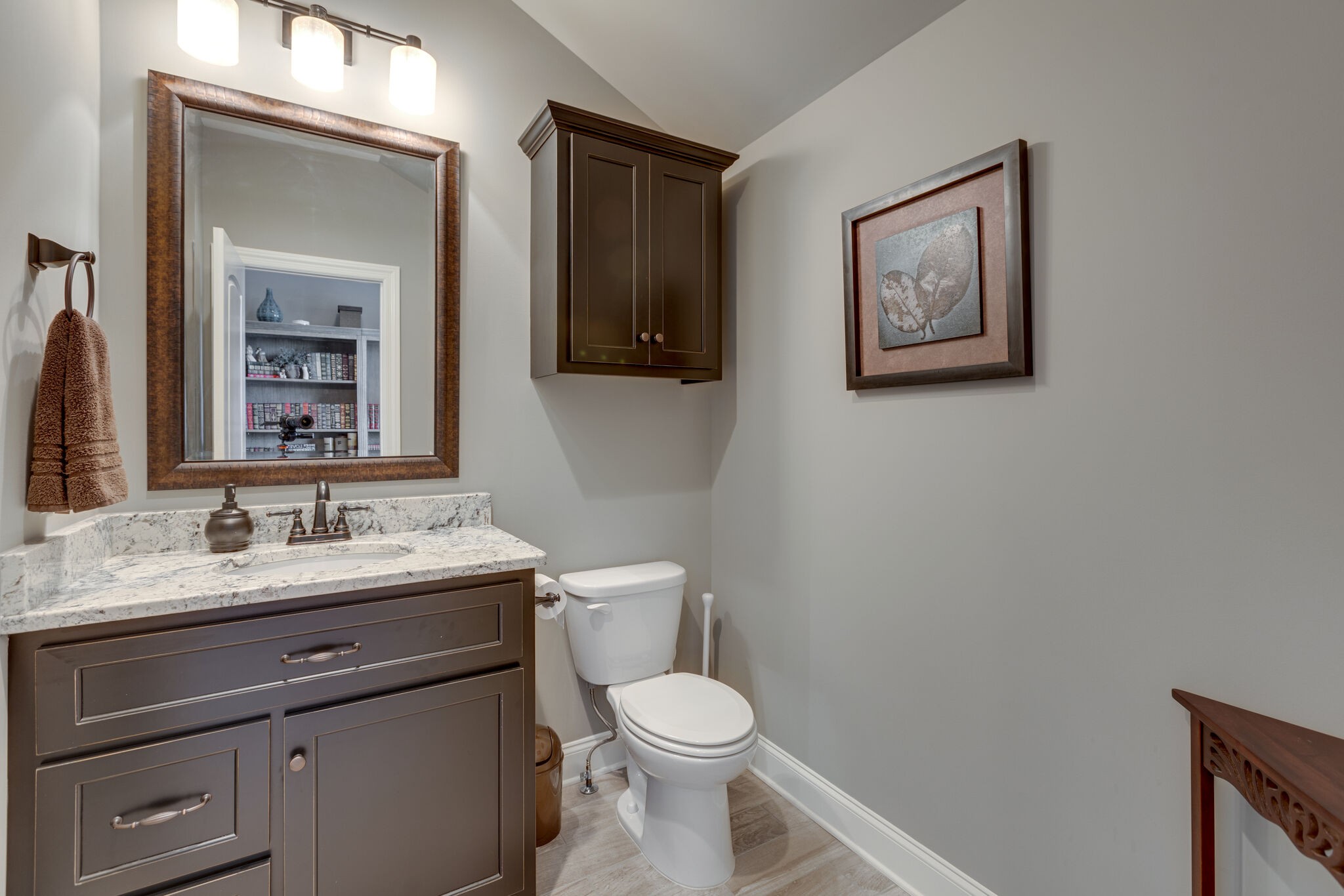 3692 Ronstadt Road Thompson's Station, TN 37179 - Photo 38 of 63 a bathroom with a toilet sink vanity and mirror