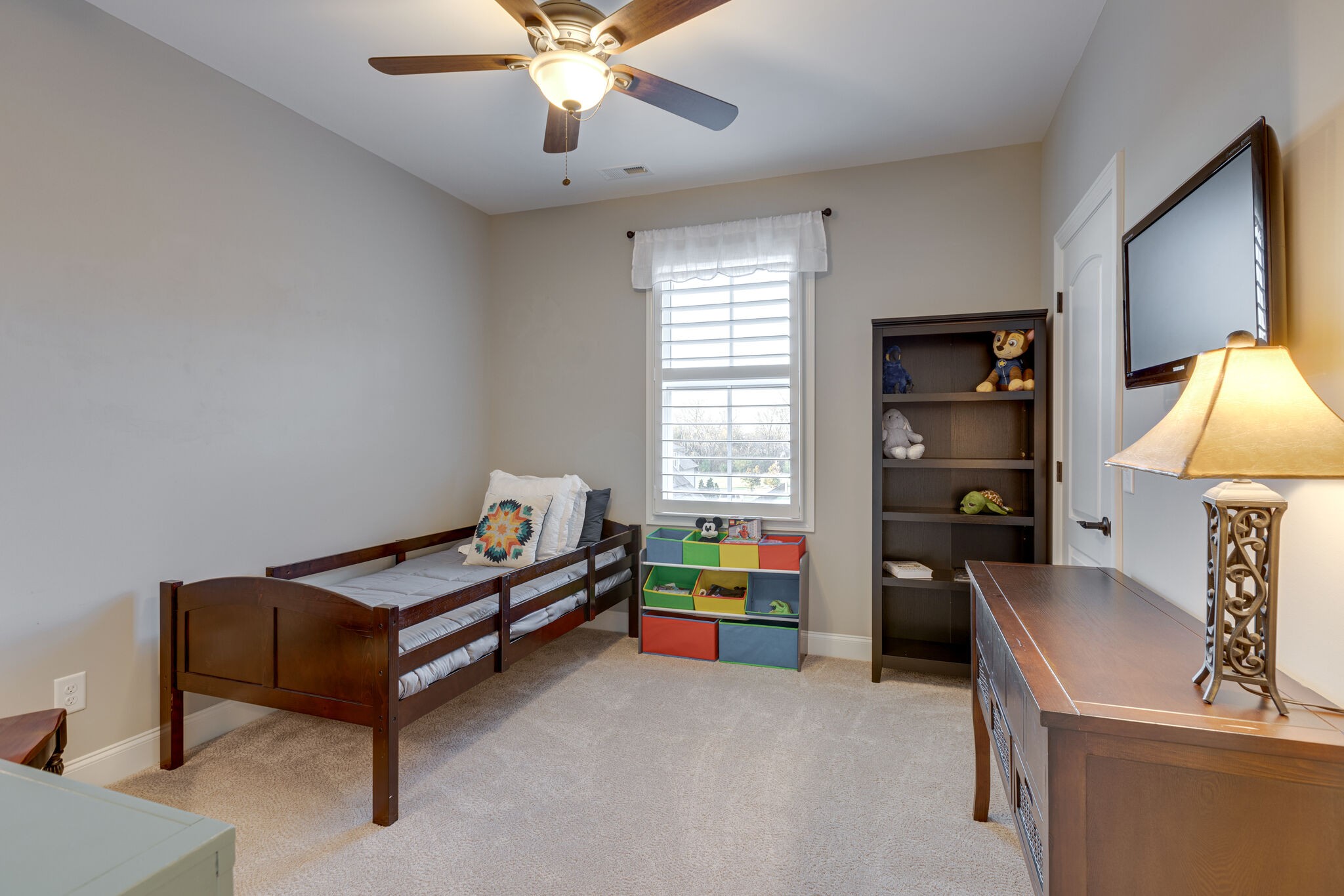 3692 Ronstadt Road Thompson's Station, TN 37179 - Photo 39 of 63 a bedroom with furniture and a lamp