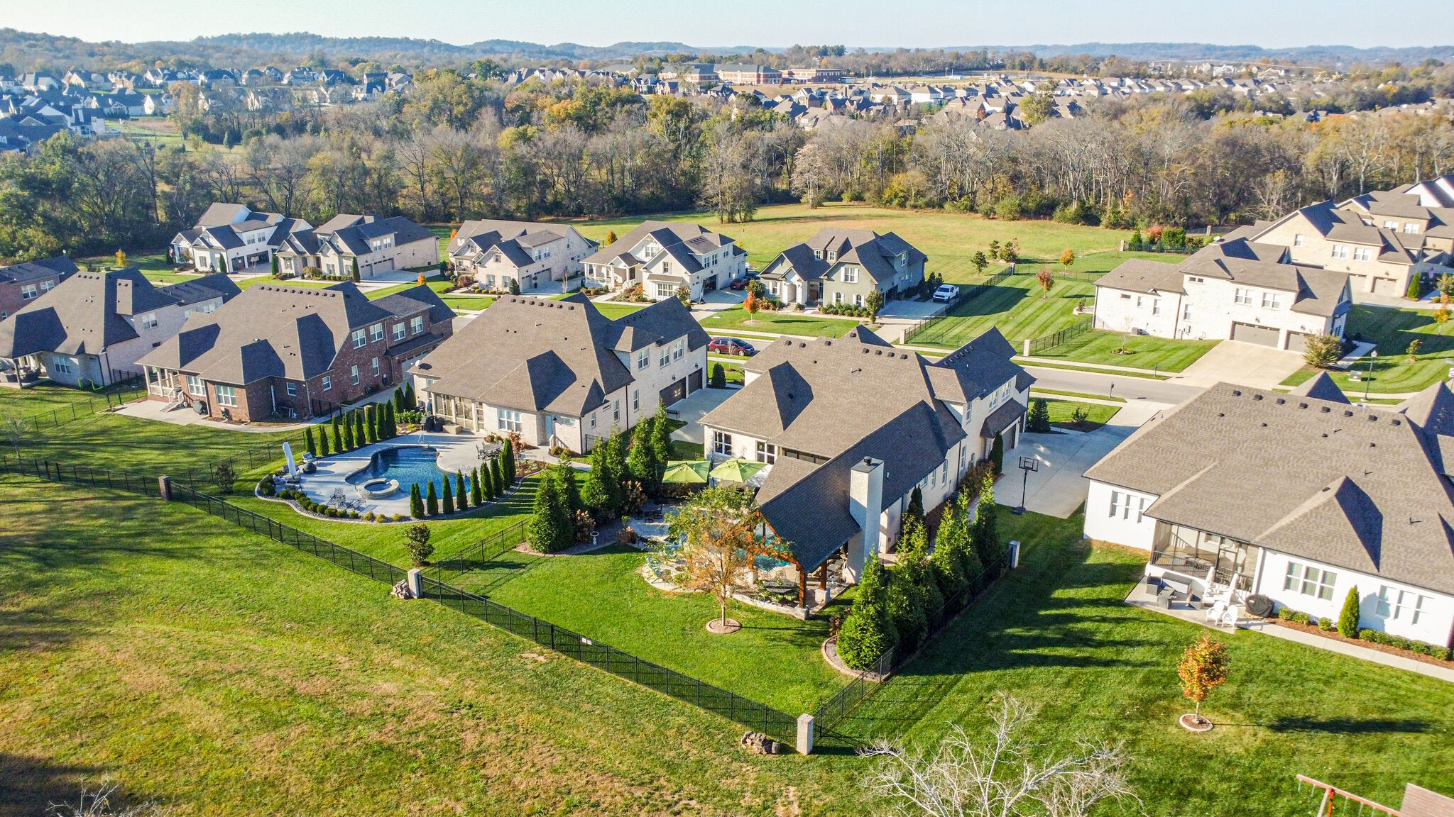 3692 Ronstadt Road Thompson's Station, TN 37179 - Photo 62 of 63 an aerial view of a house with a garden and lake view