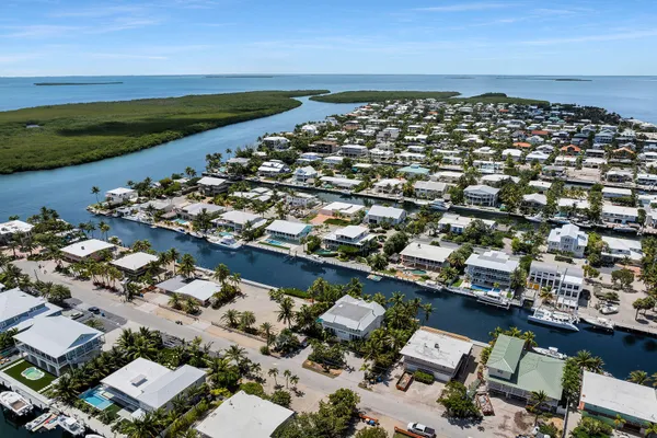 a bedroom with a bed and a television