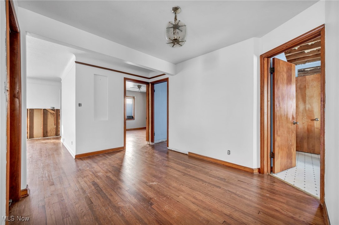 14750 Schreiber Road Maple Heights, OH 44137 - Photo 10 of 44 Unfurnished room with hardwood / wood-style flooring and baseboards