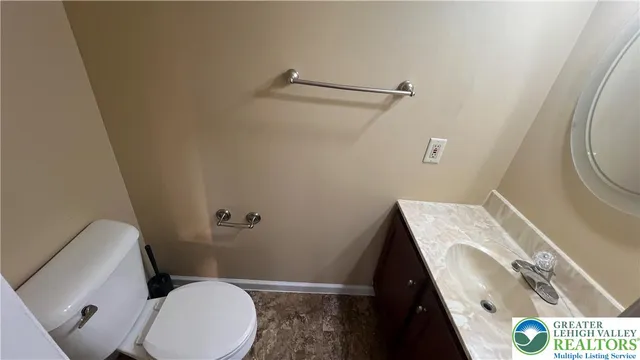 a bathroom with a toilet and a sink
