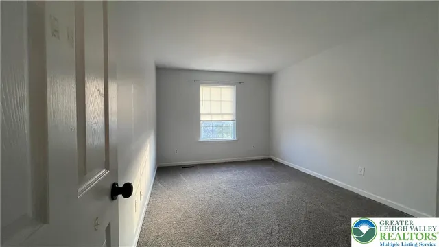 a view of hallway with wooden floor