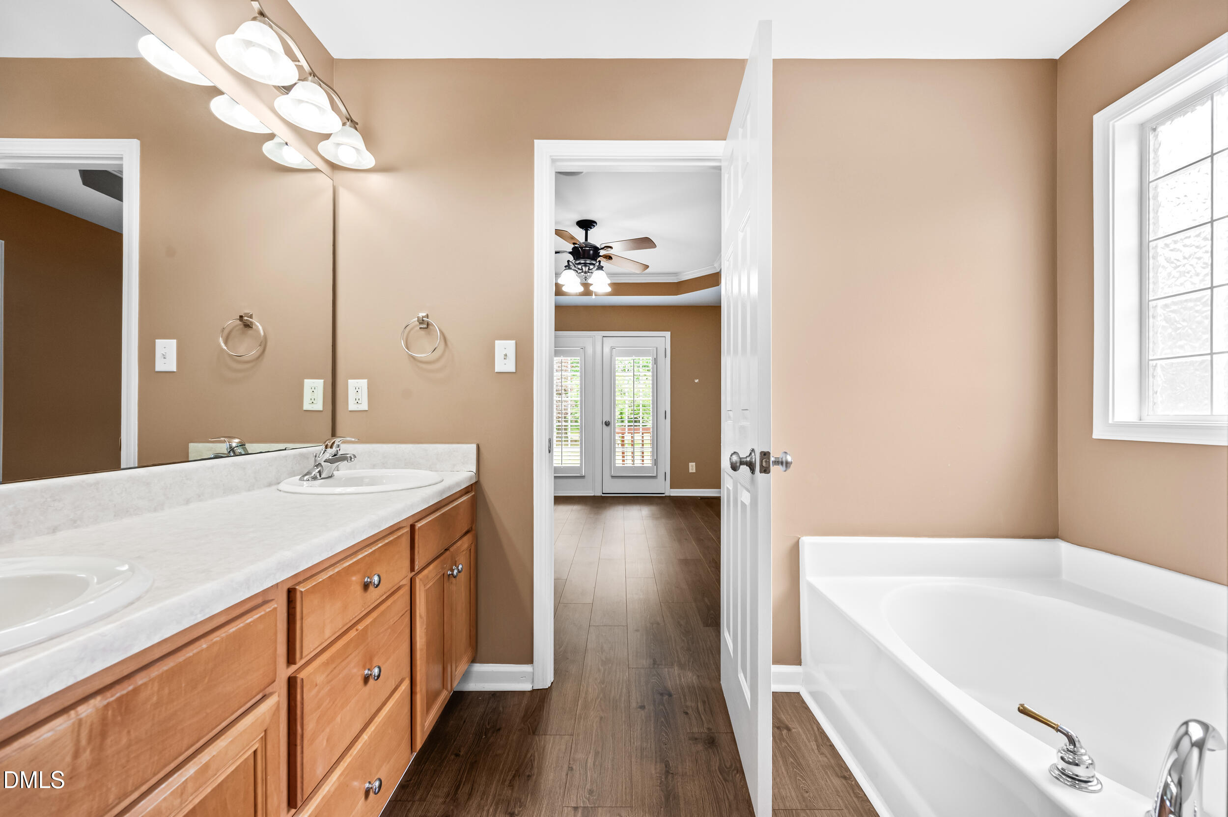 125 Rustic Lane Smithfield, NC 27577 - Photo 25 of 49 a bathroom with a tub sink and mirror