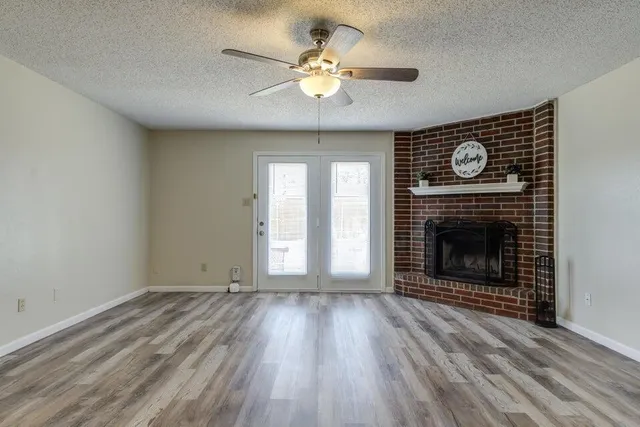 a view of a room with an empty ceiling fan