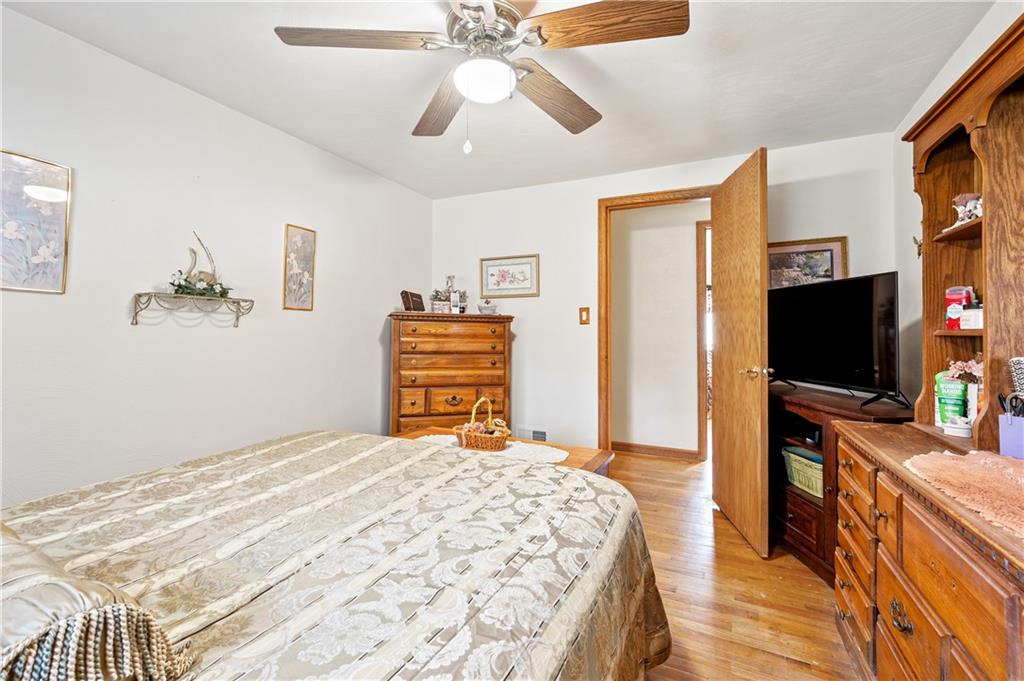 1027 Fiddleback Drive McKees Rocks, PA 15136 - Photo 15 of 25 a bedroom with a bed and a flat screen tv