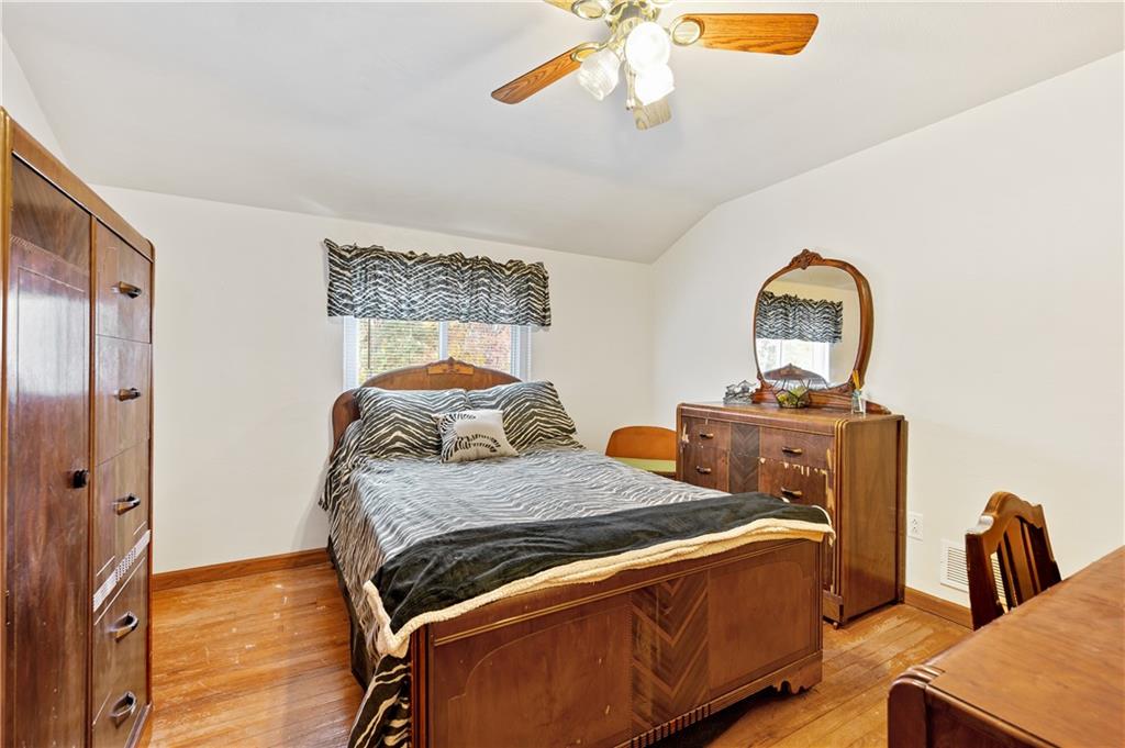 1027 Fiddleback Drive McKees Rocks, PA 15136 - Photo 19 of 25 a bedroom with a bed and a mirror