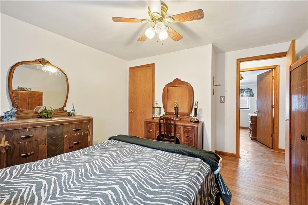 1027 Fiddleback Drive McKees Rocks, PA 15136 - Photo 20 of 25 a bedroom with a bed and a chandelier