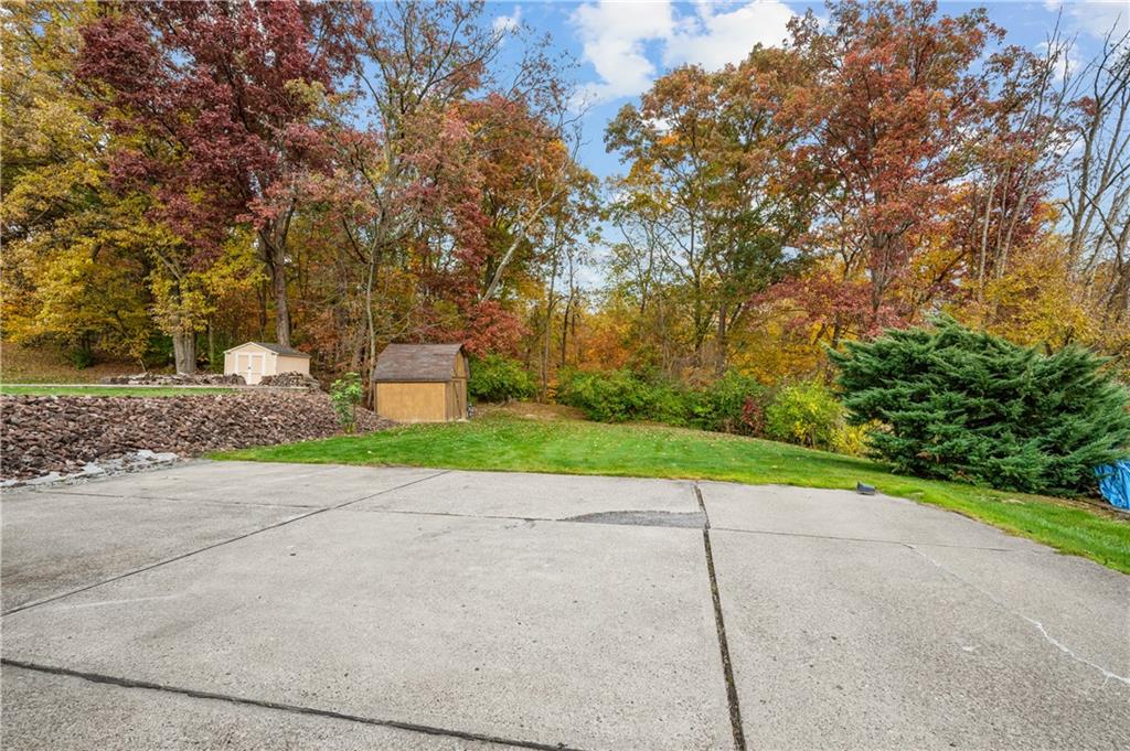 1027 Fiddleback Drive McKees Rocks, PA 15136 - Photo 23 of 25 a green field with trees in the background