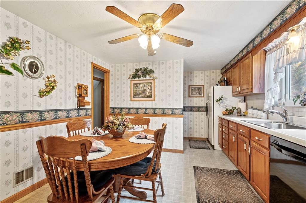 1027 Fiddleback Drive McKees Rocks, PA 15136 - Photo 5 of 25 a large kitchen with a table and chairs in it
