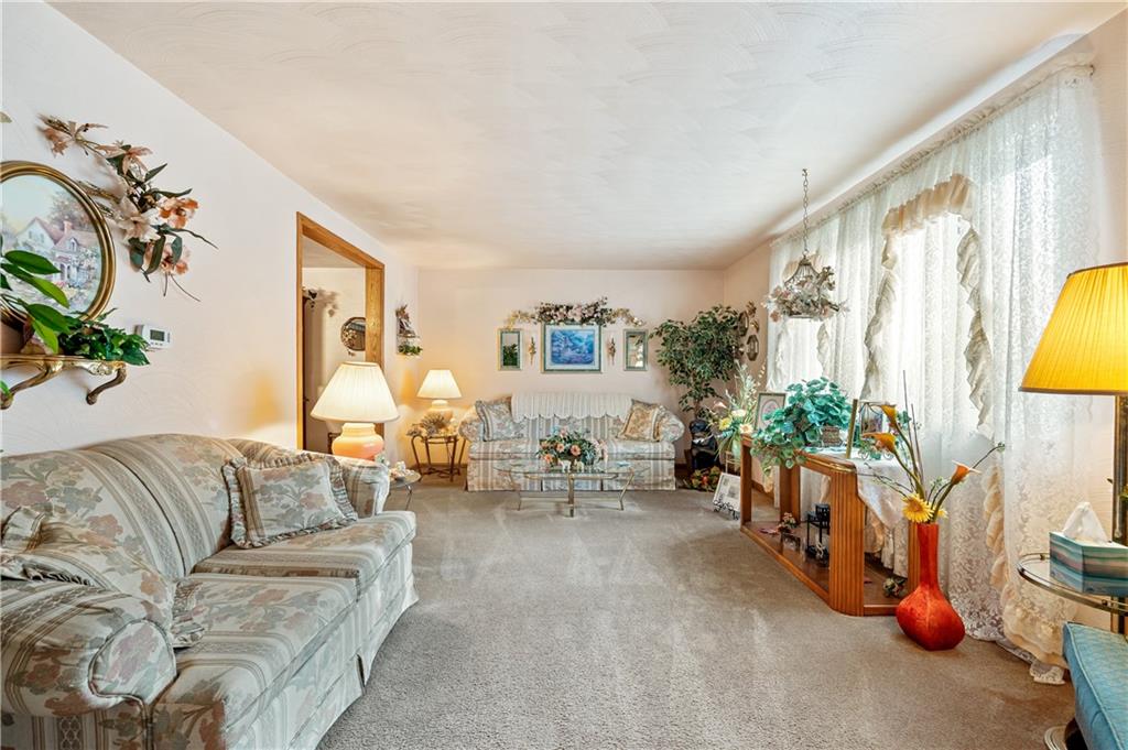 1027 Fiddleback Drive McKees Rocks, PA 15136 - Photo 7 of 25 a living room with furniture and a large window