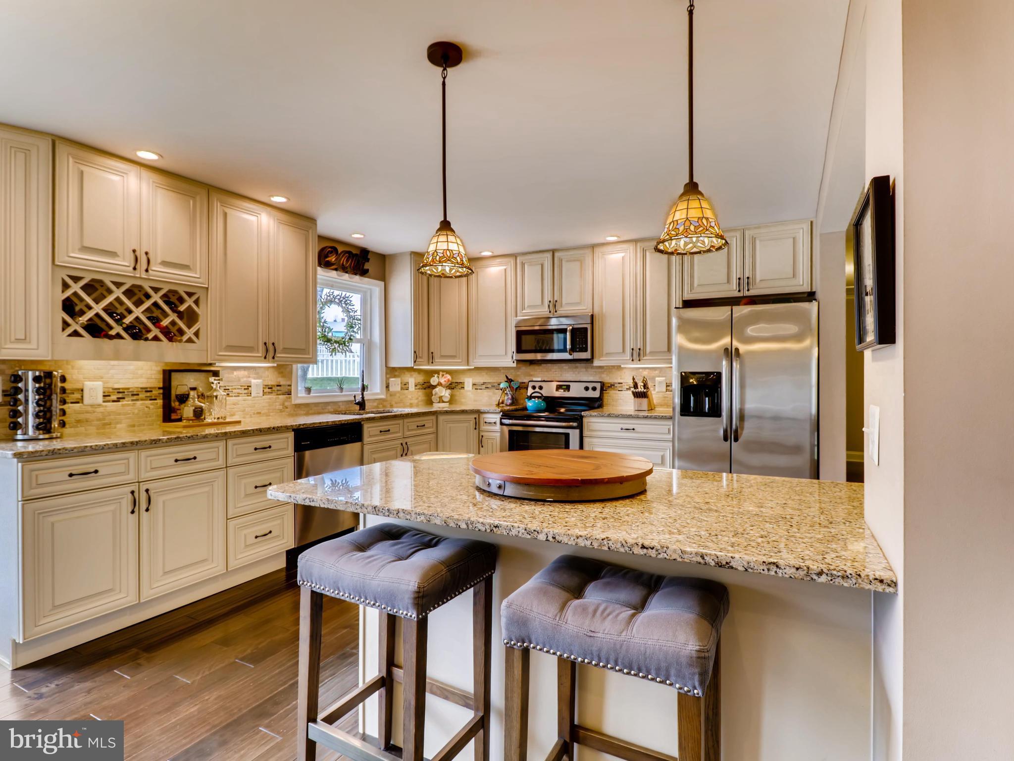 8018 Yellowstone Road Kingsville, MD 21087 - Photo 7 of 33 KITCHEN ISLAND WITH BREAKFAST BAR