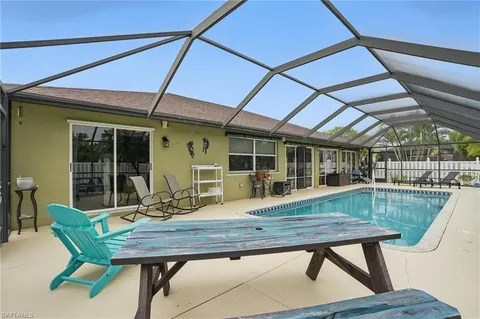 a wooden bench sitting in front of a building