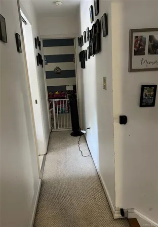 a view of walk in closet with clothes