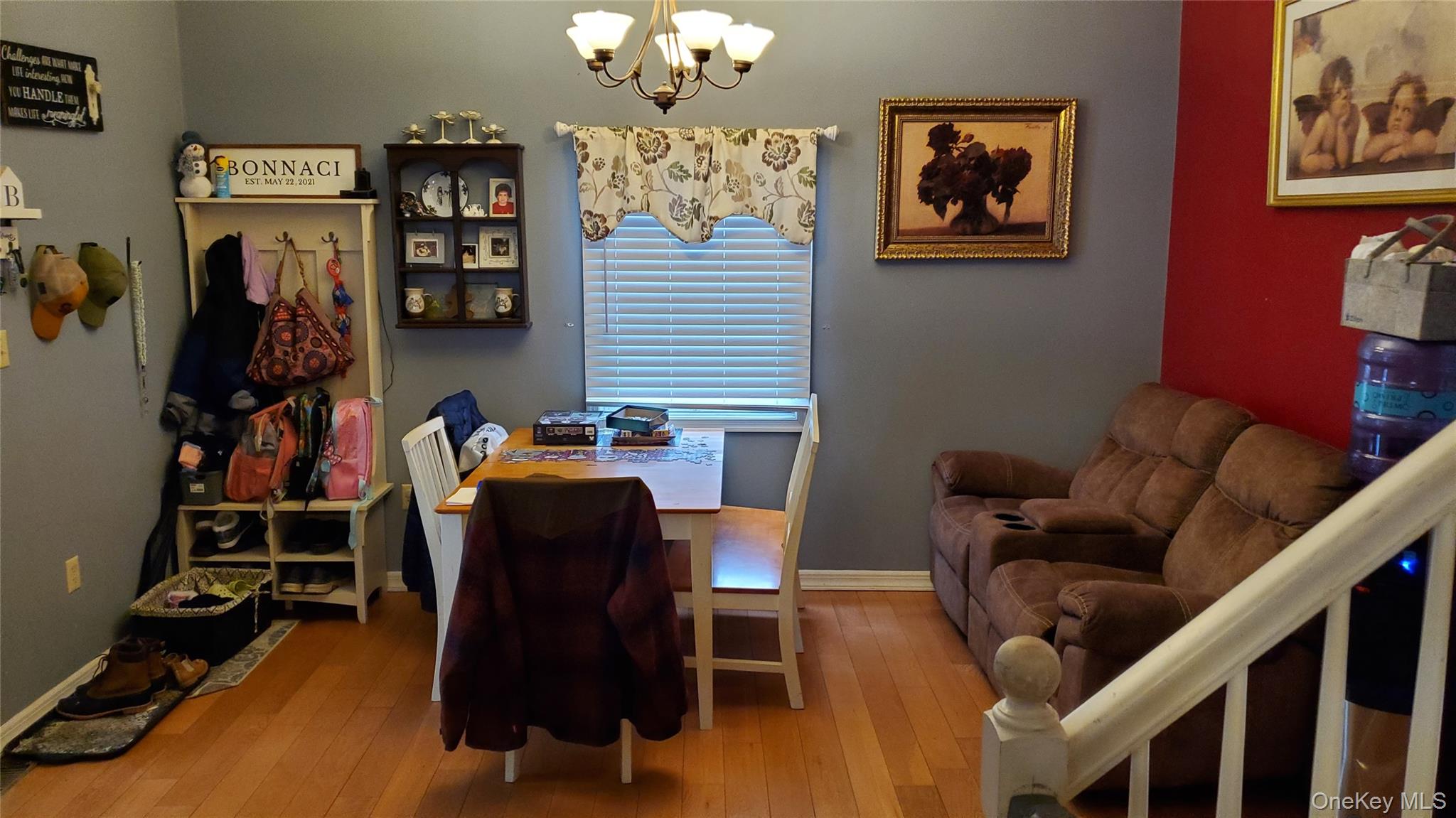 807 Beaver Brook Road Narrowsburg, NY 12764 - Photo 2 of 25 Dining area featuring wood-type flooring and a chandelier