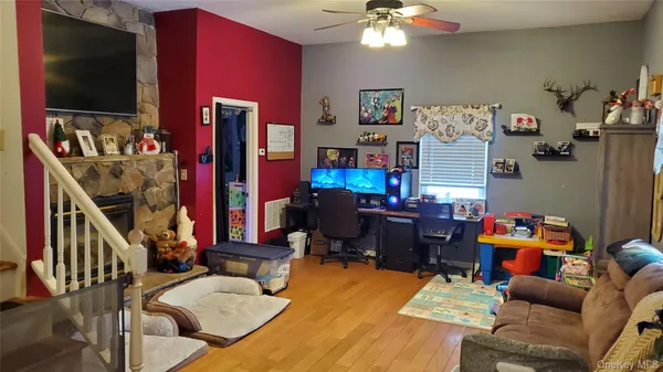 a living room with furniture and a flat screen tv