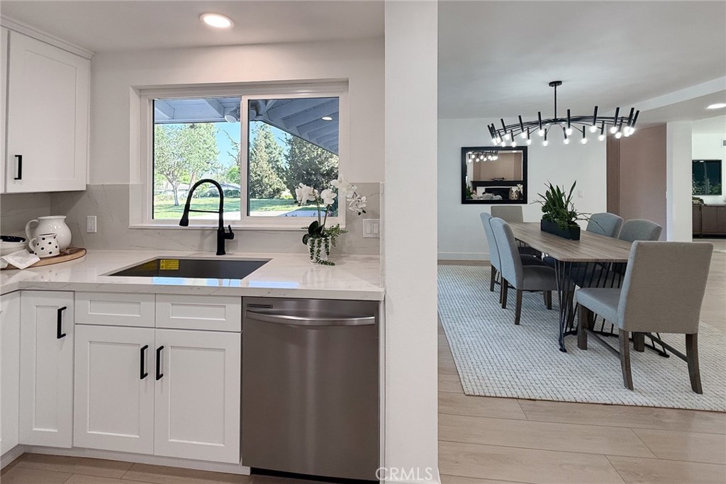 2225 Terraza Place Fullerton, CA 92835 - Photo 18 of 73 a kitchen with a stove a refrigerator and a view of living room