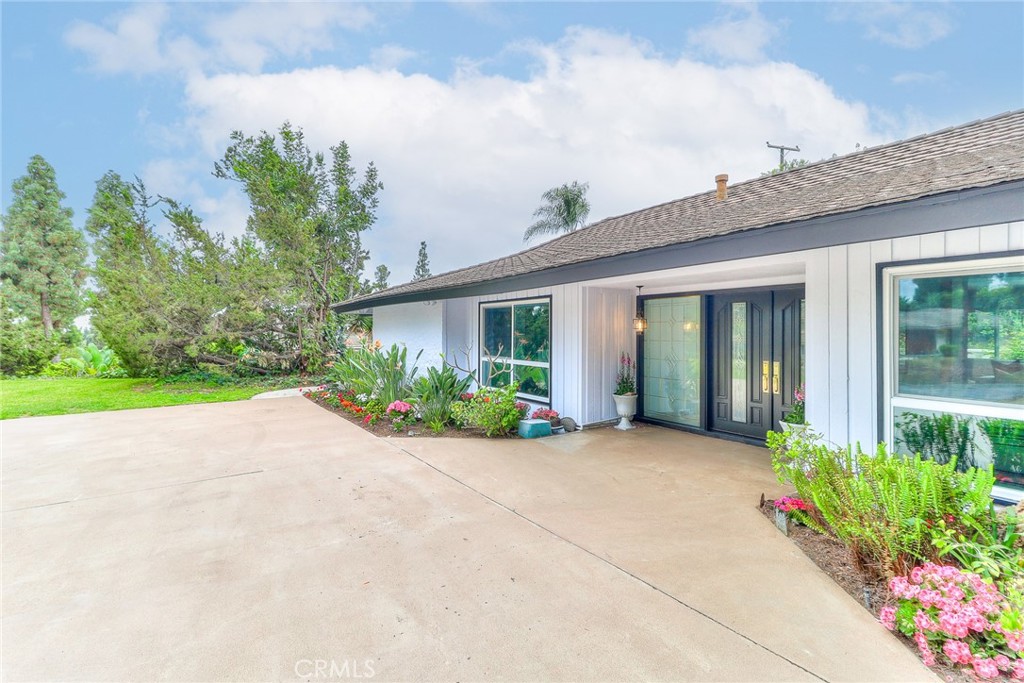 2225 Terraza Place Fullerton, CA 92835 - Photo 2 of 73 a view of a house with potted plants and a large tree