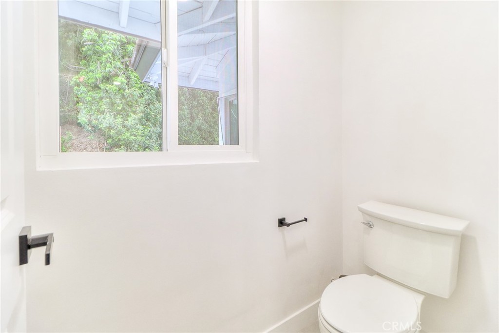 2225 Terraza Place Fullerton, CA 92835 - Photo 56 of 73 a white toilet sitting next to a window