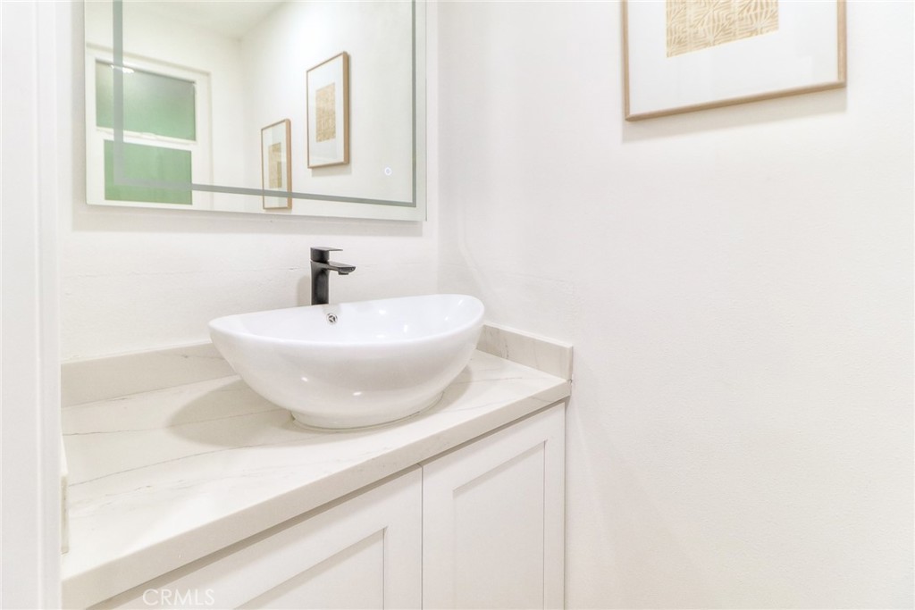 2225 Terraza Place Fullerton, CA 92835 - Photo 57 of 73 a bathroom with a sink and a mirror