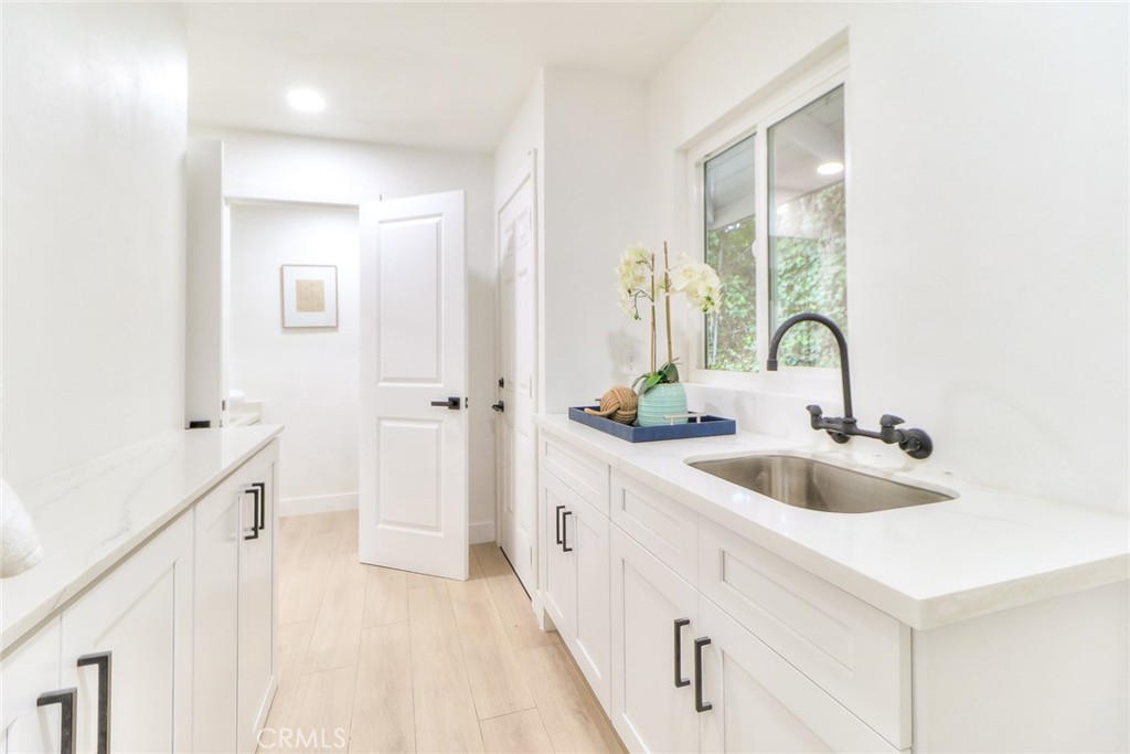 2225 Terraza Place Fullerton, CA 92835 - Photo 60 of 73 a kitchen with a sink and cabinets