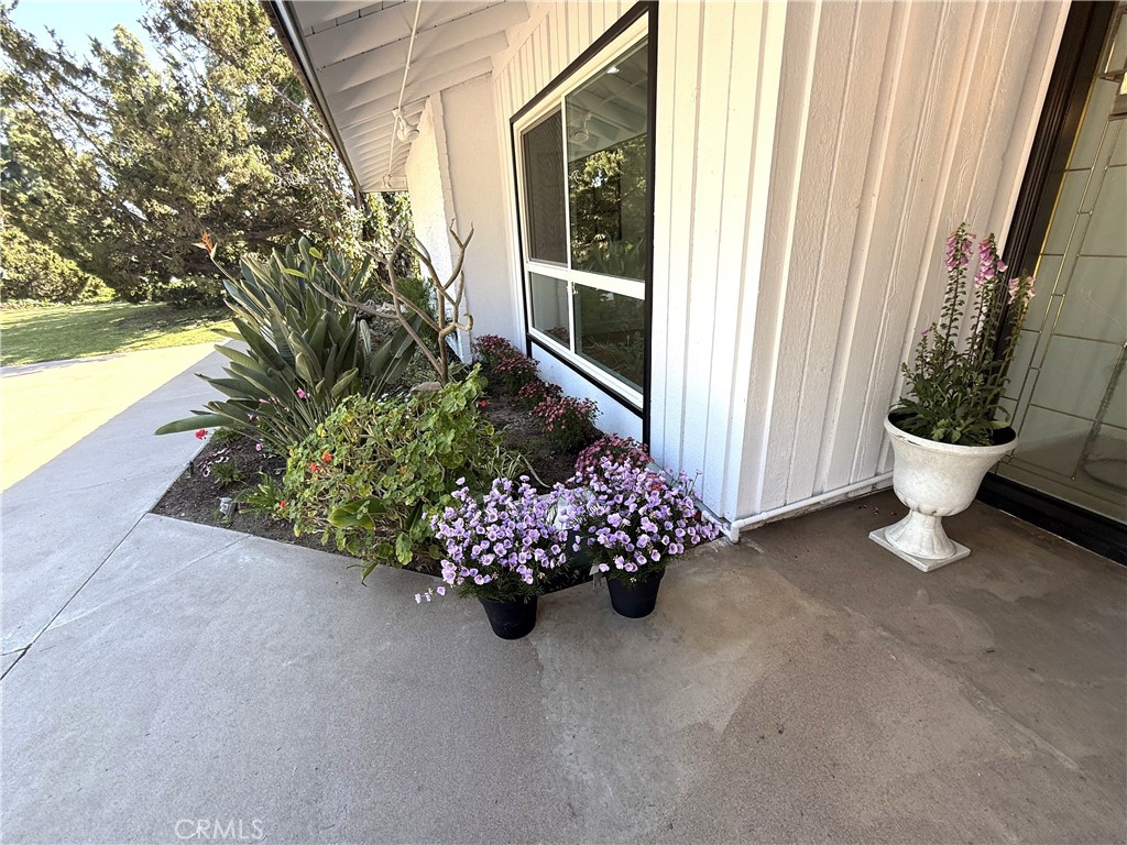 2225 Terraza Place Fullerton, CA 92835 - Photo 9 of 73 a front view of a house with a flower garden