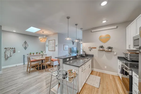 a kitchen with a table and chairs in it