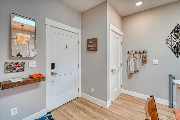 a view of a bedroom with baby bed and closet