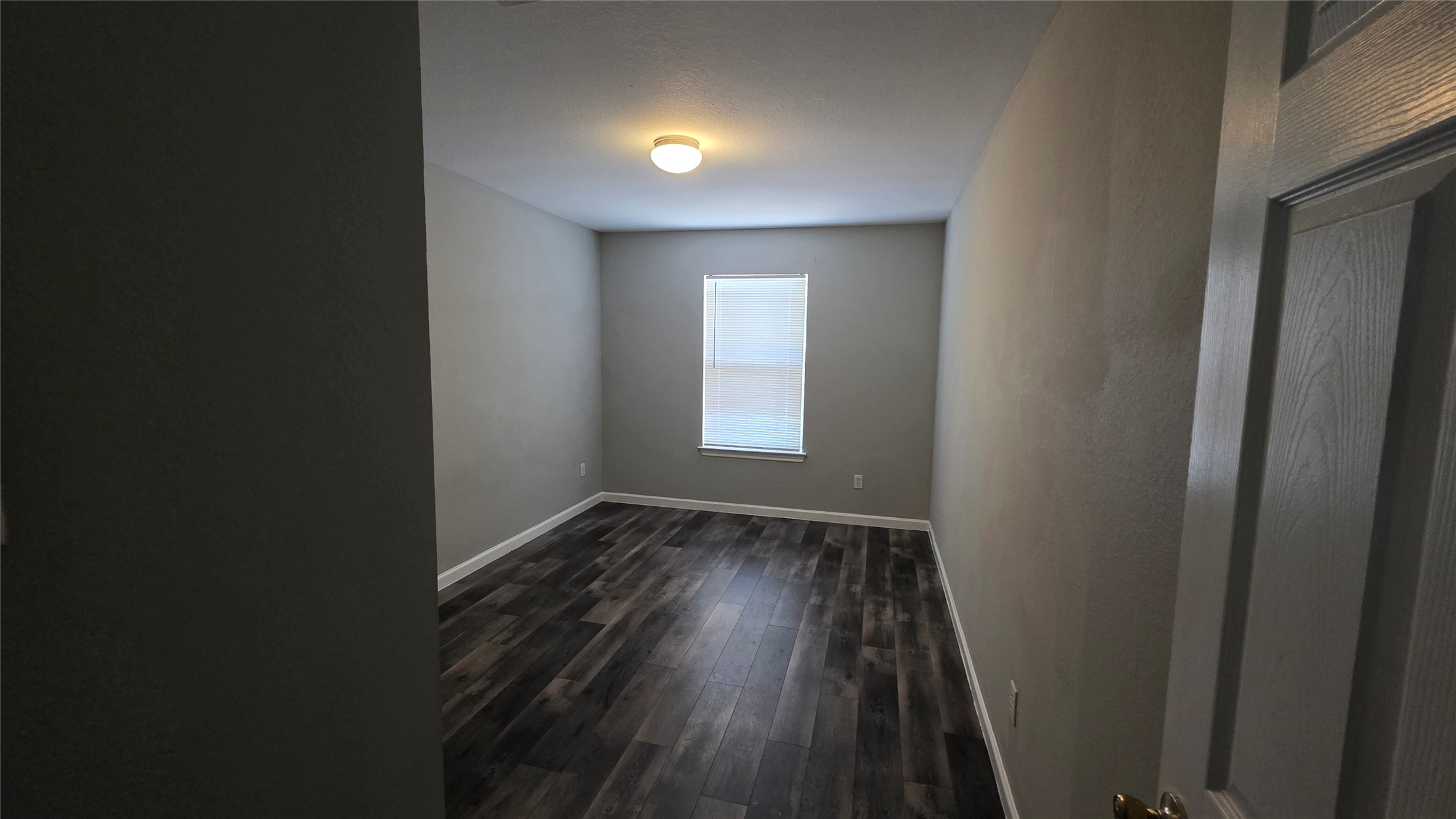 5605 Clyde Lane Austin, TX 78754 - Photo 13 of 26 a view of hallway with window and wooden floor