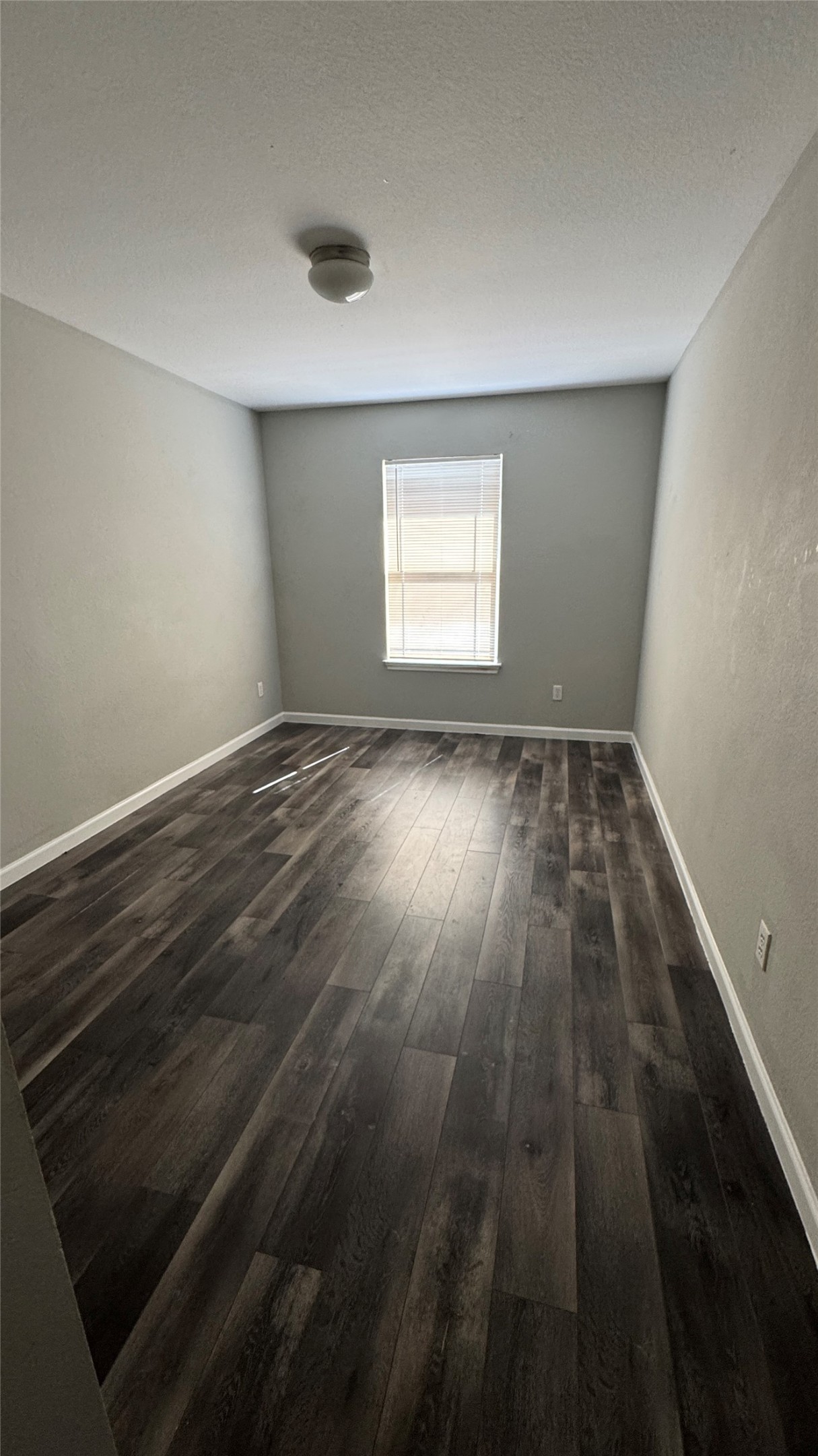 5605 Clyde Lane Austin, TX 78754 - Photo 17 of 26 an empty room with wooden floor and windows