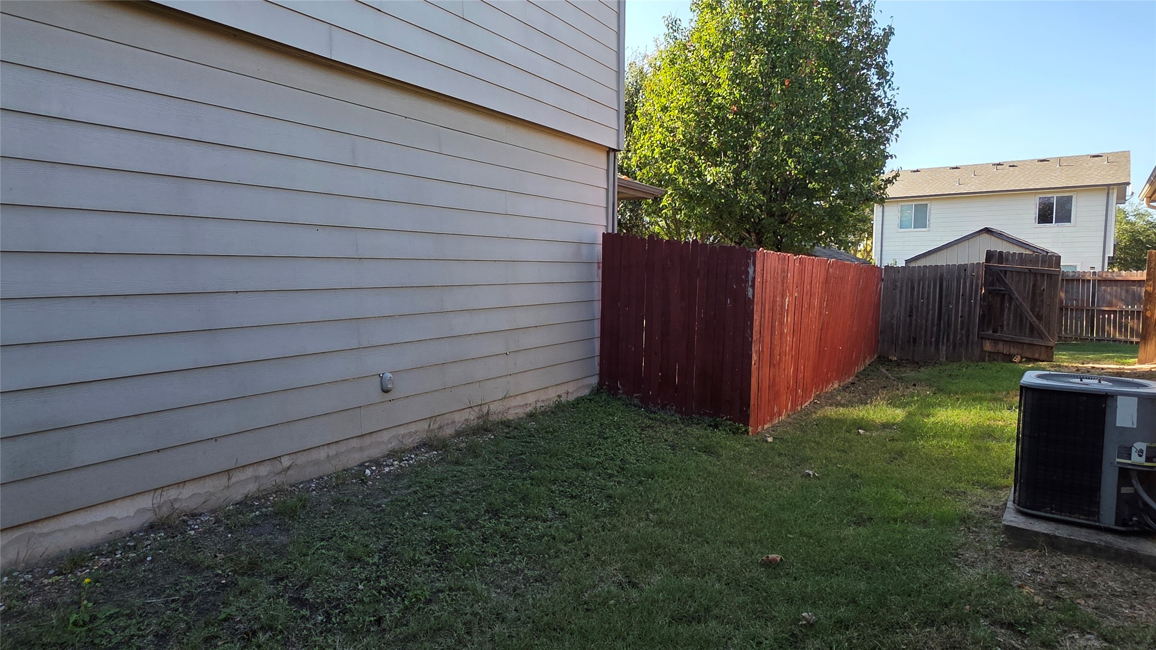 5605 Clyde Lane Austin, TX 78754 - Photo 4 of 26 a view of backyard with small cabin and wooden fencing