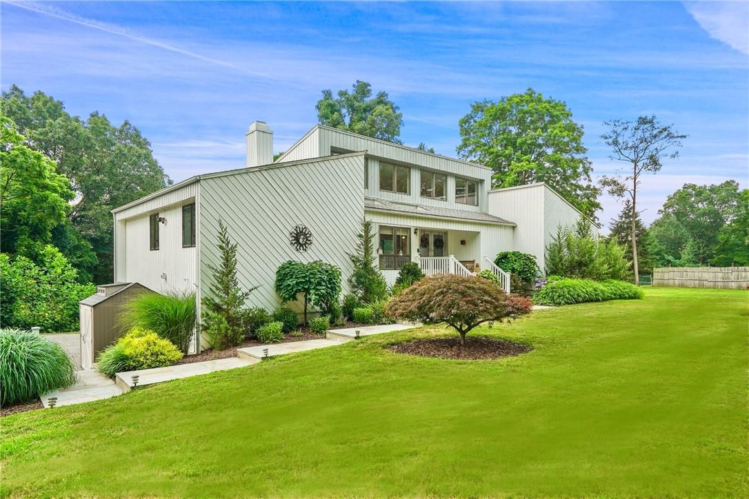 417 Union Valley Road Mahopac, NY 10541 - Photo 1 of 1 Back of house featuring a lawn