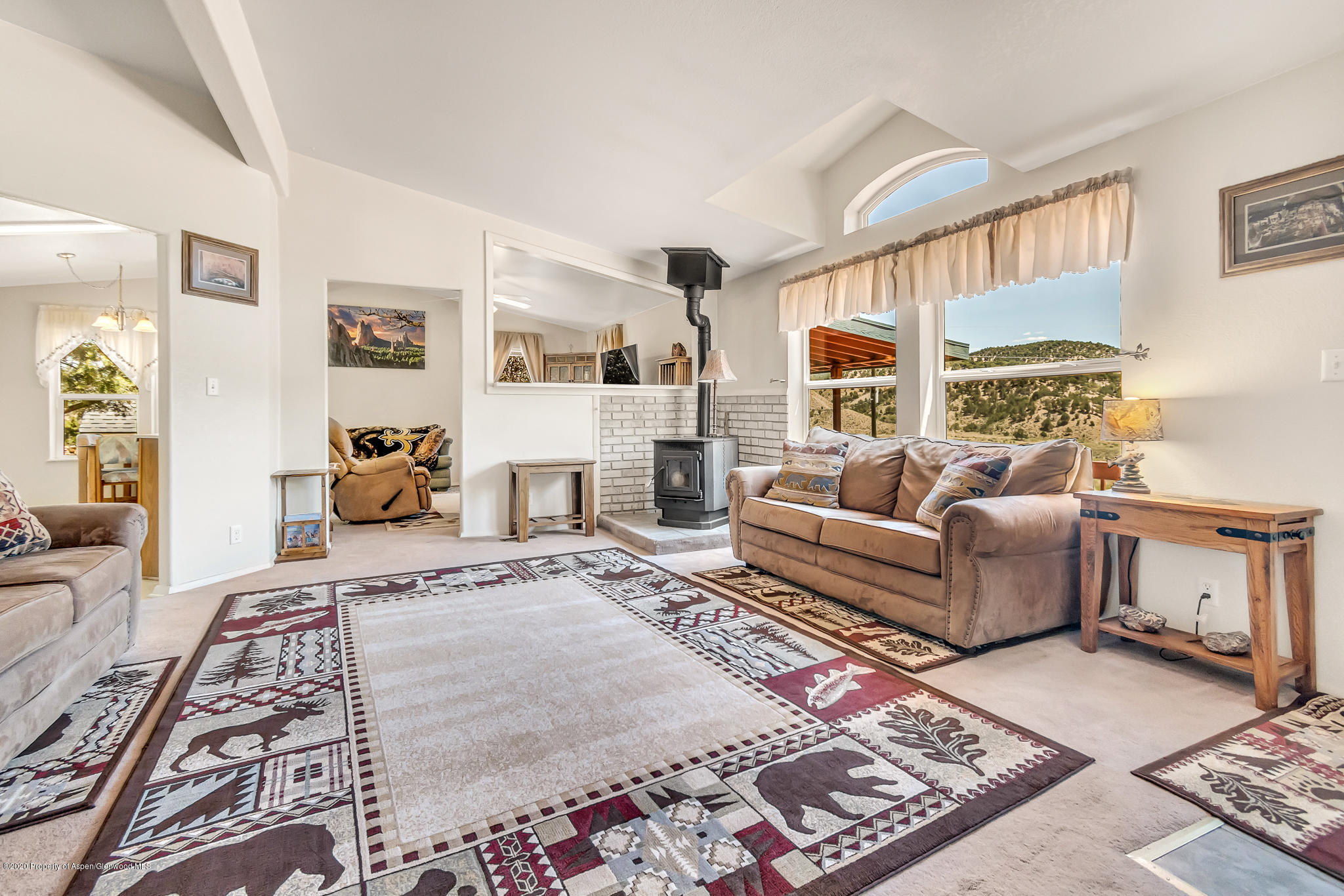 1205 County Road 252 Rifle, CO 81650 - Photo 13 of 37 a living room with furniture and a rug