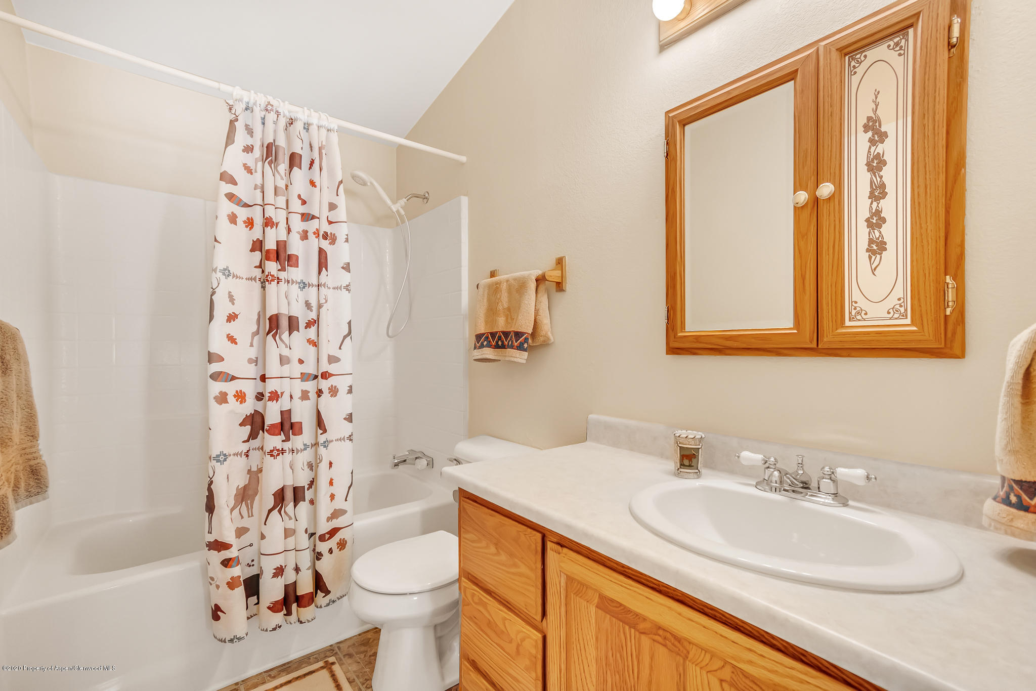 1205 County Road 252 Rifle, CO 81650 - Photo 19 of 37 a bathroom with a sink toilet and shower