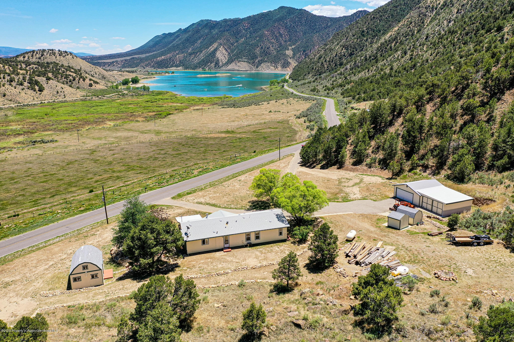 1205 County Road 252 Rifle, CO 81650 - Photo 2 of 37 a view of a lake with a mountain