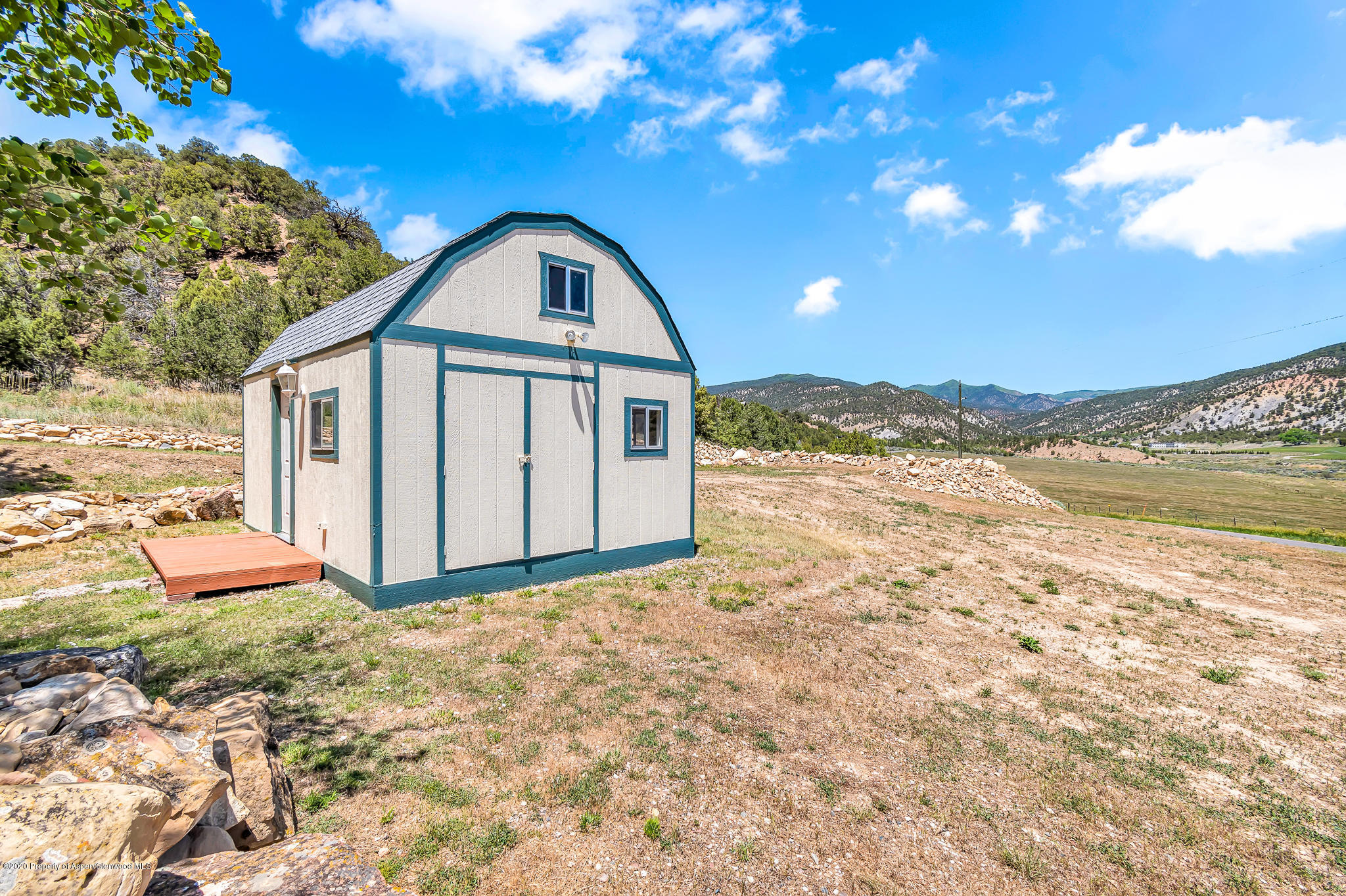 1205 County Road 252 Rifle, CO 81650 - Photo 22 of 37 a view of a house with a yard