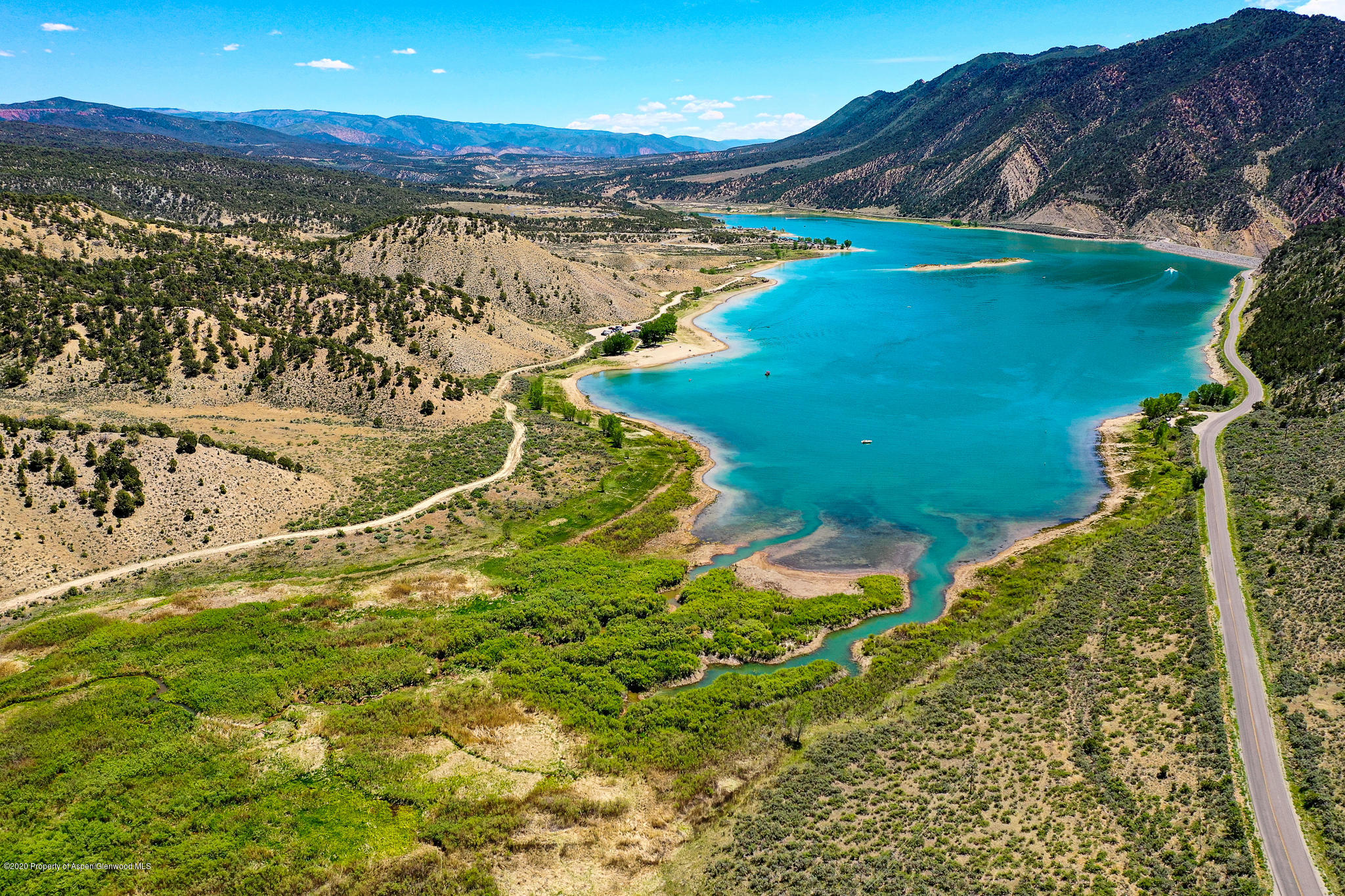 1205 County Road 252 Rifle, CO 81650 - Photo 29 of 37 a view of a lake with a mountain