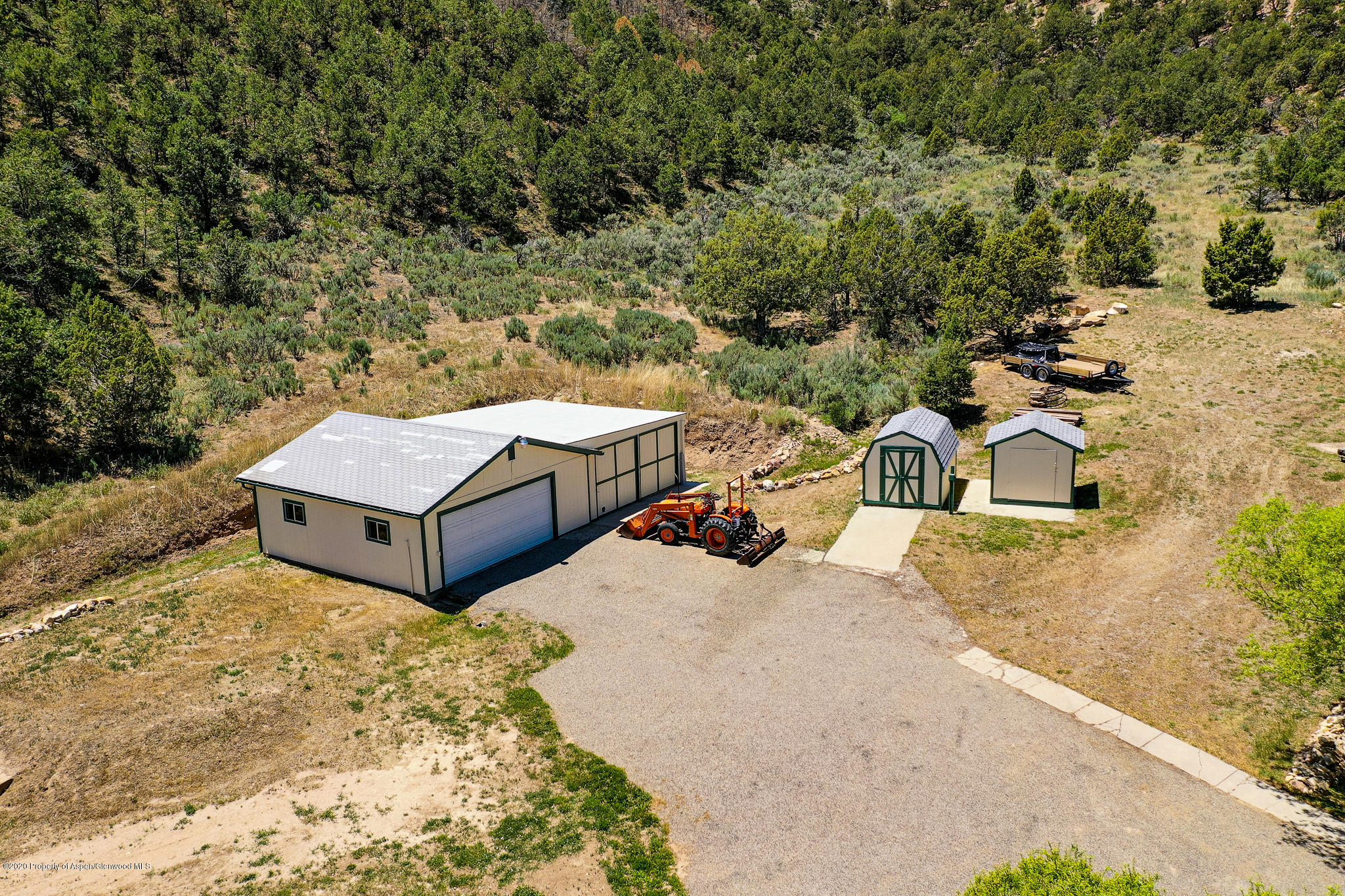 1205 County Road 252 Rifle, CO 81650 - Photo 35 of 37 a view of a house with large trees and park