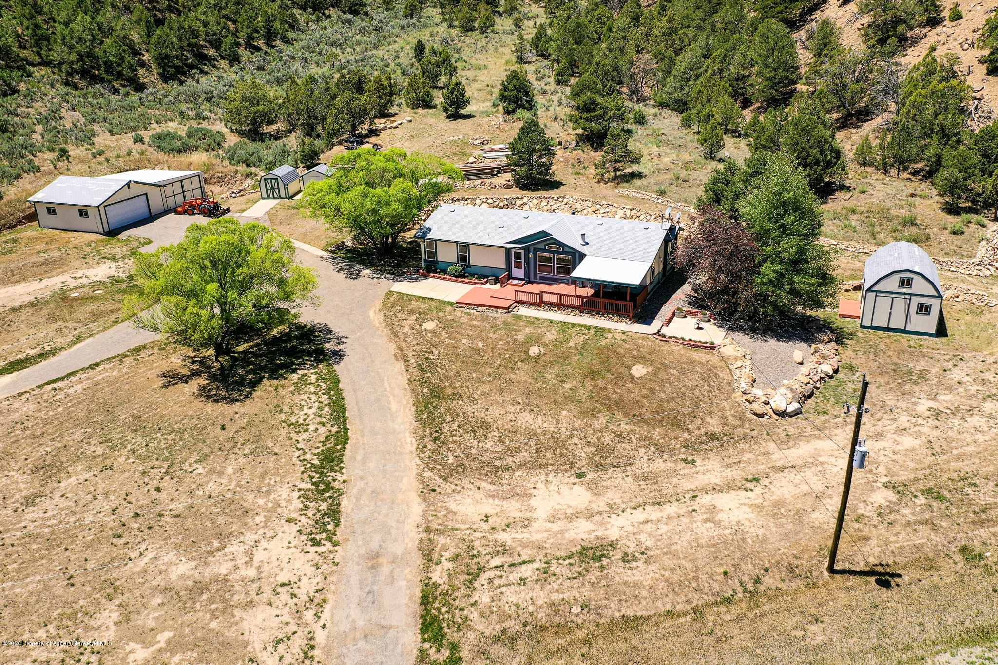 1205 County Road 252 Rifle, CO 81650 - Photo 36 of 37 a view of a yard with large trees