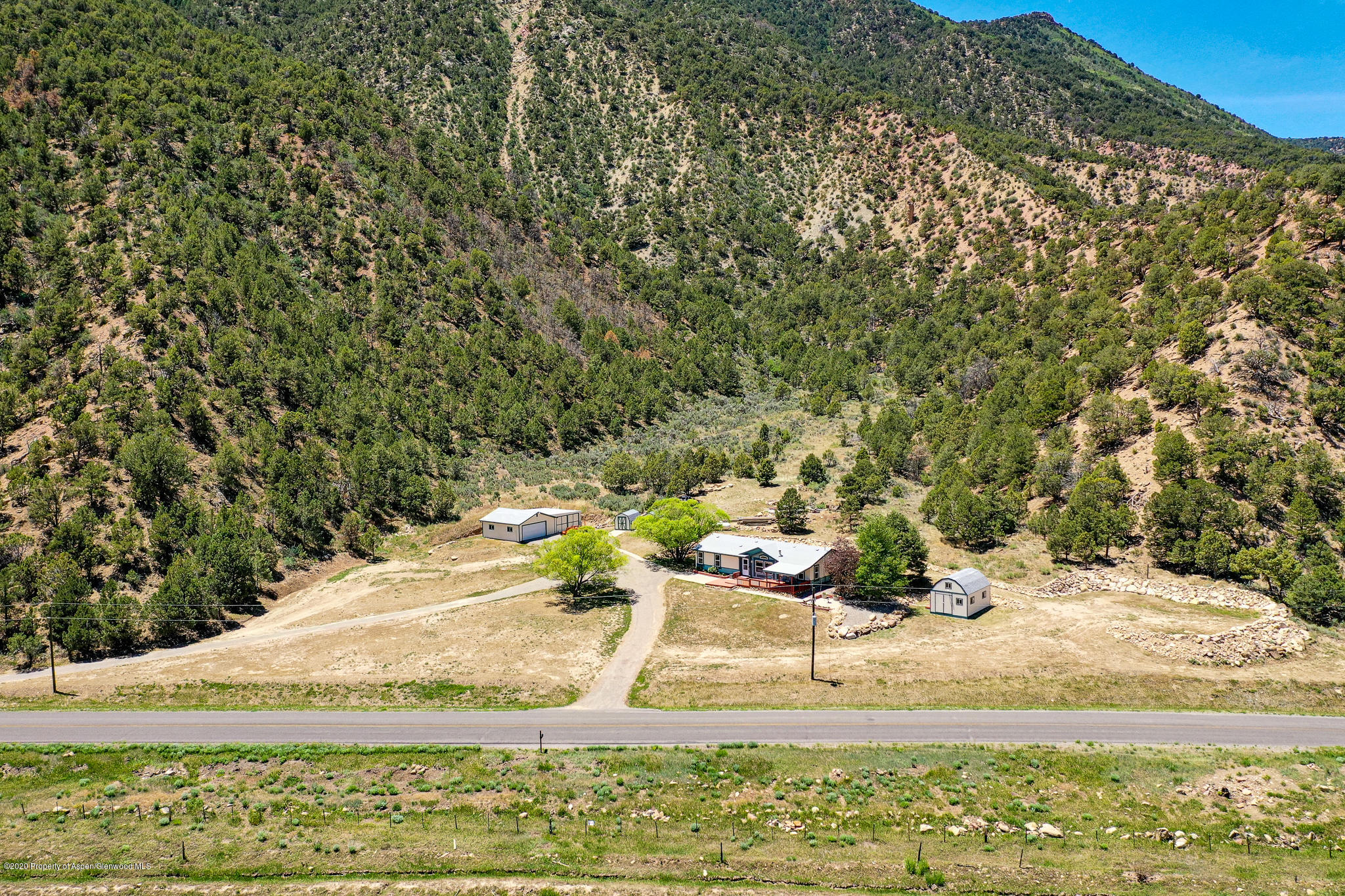 1205 County Road 252 Rifle, CO 81650 - Photo 37 of 37 a view of a yard with wooden fence