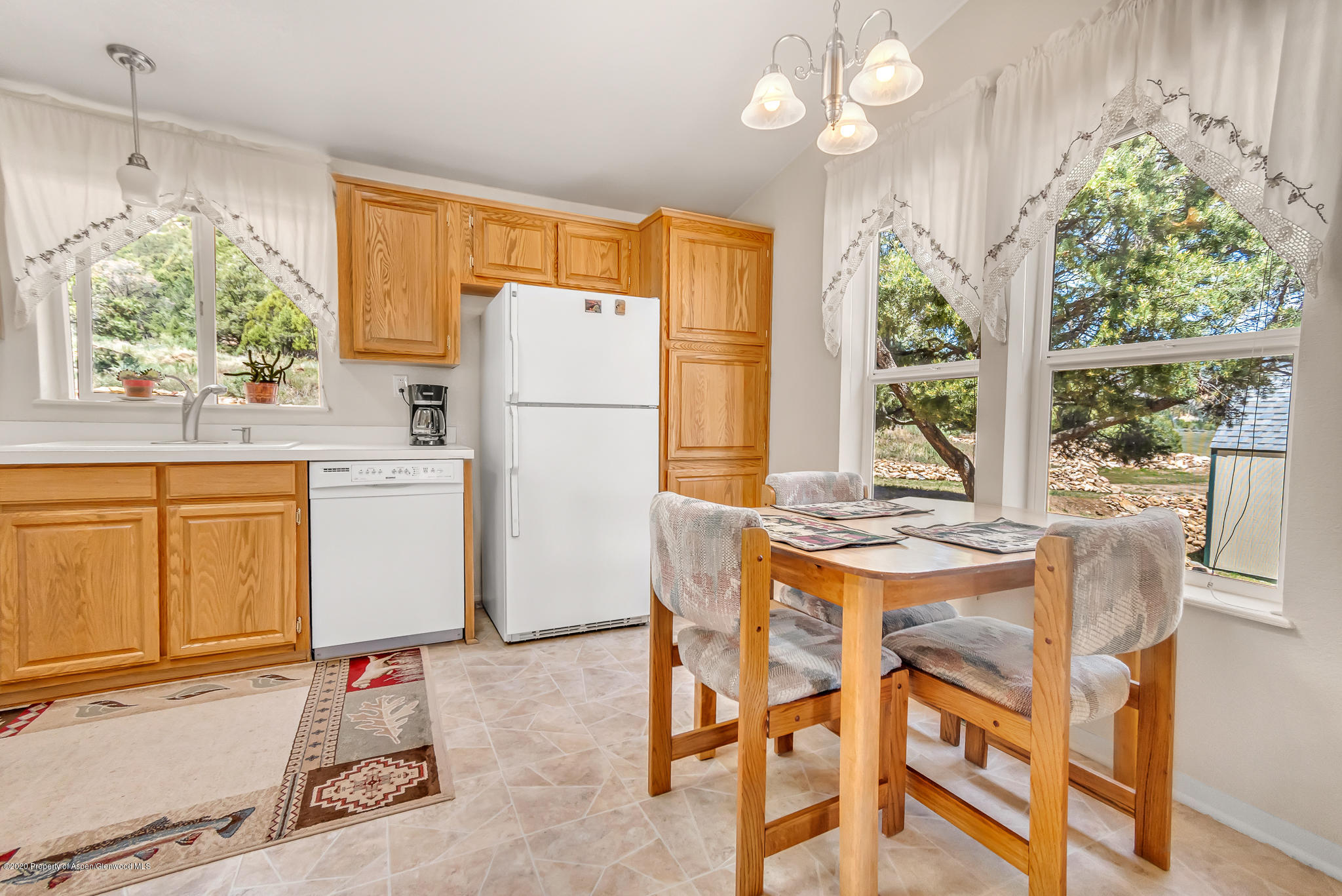 1205 County Road 252 Rifle, CO 81650 - Photo 5 of 37 a view of a dining room with furniture window and outside view