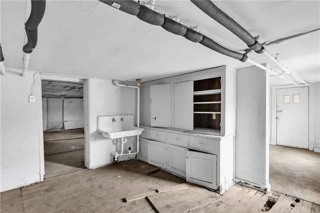 a bathroom with a granite countertop sink a toilet and a mirror