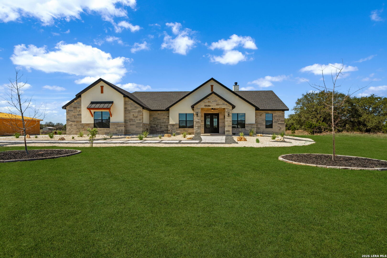 344 Buckskin Trail Bandera, TX 78003 - Photo 1 of 50 a front view of a house with a yard