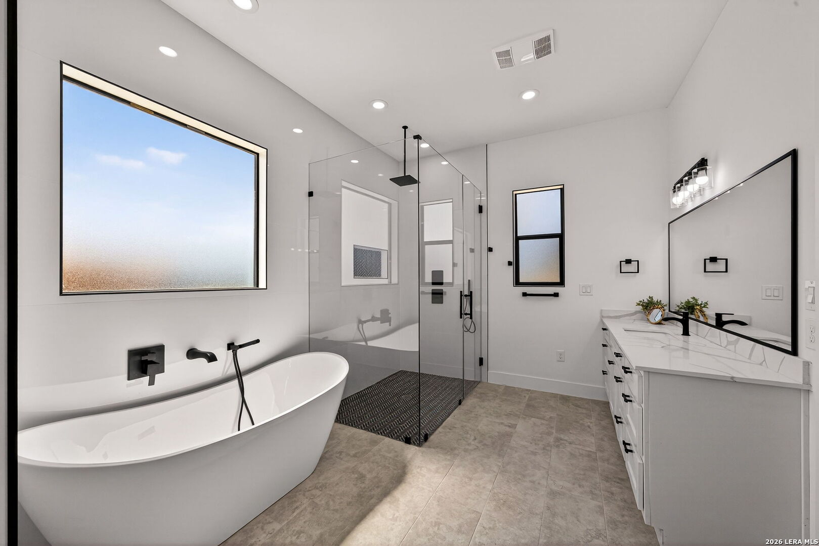 344 Buckskin Trail Bandera, TX 78003 - Photo 23 of 50 a spacious bathroom with a tub sink and mirror