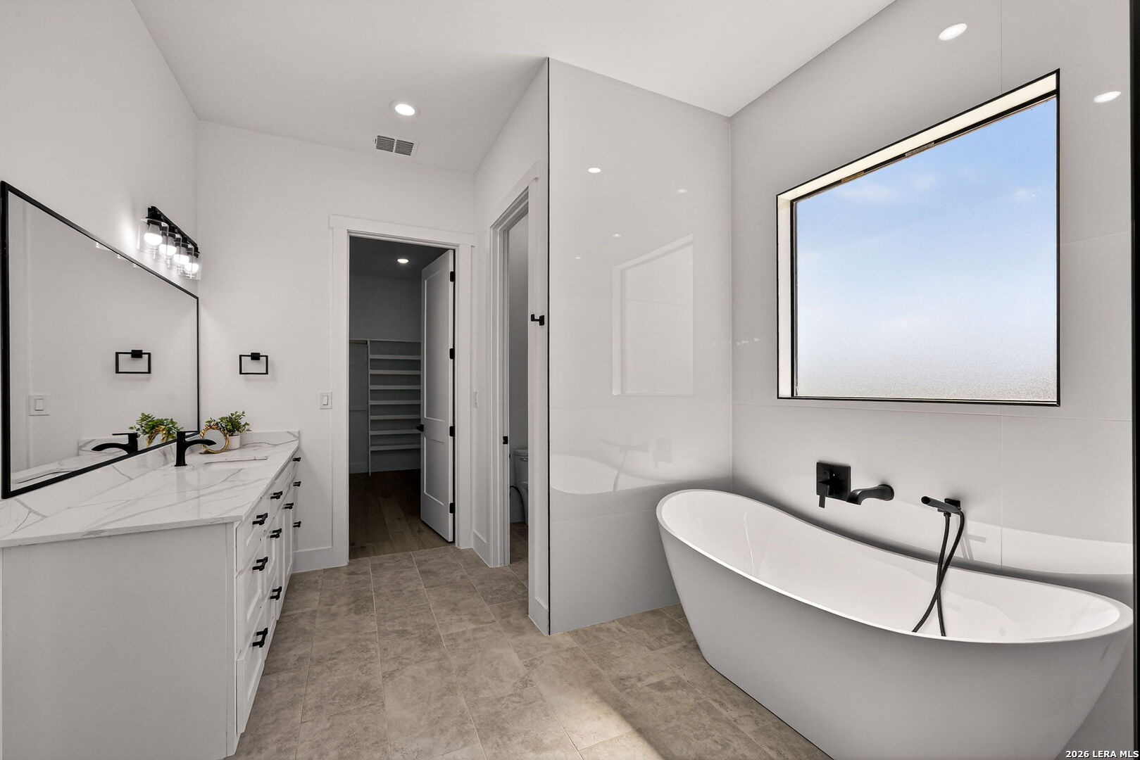 344 Buckskin Trail Bandera, TX 78003 - Photo 24 of 50 a bathroom with a bathtub and a sink