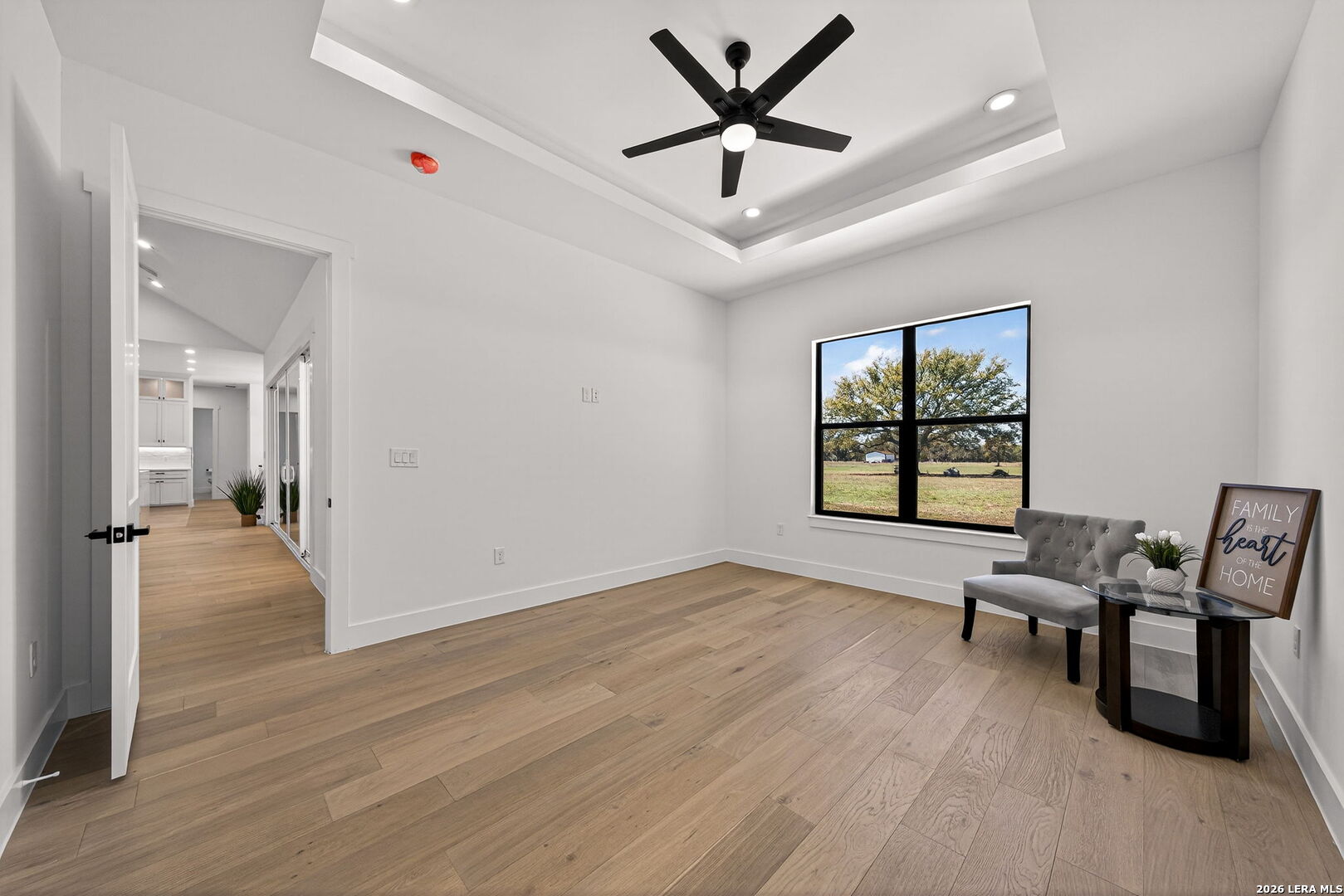 344 Buckskin Trail Bandera, TX 78003 - Photo 31 of 50 an empty room with windows and ceiling fan