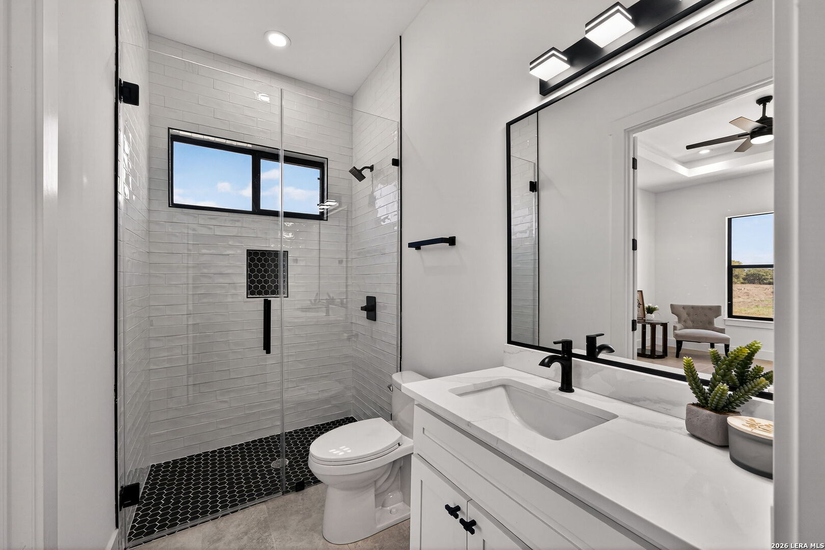 344 Buckskin Trail Bandera, TX 78003 - Photo 32 of 50 a bathroom with a sink a toilet and shower