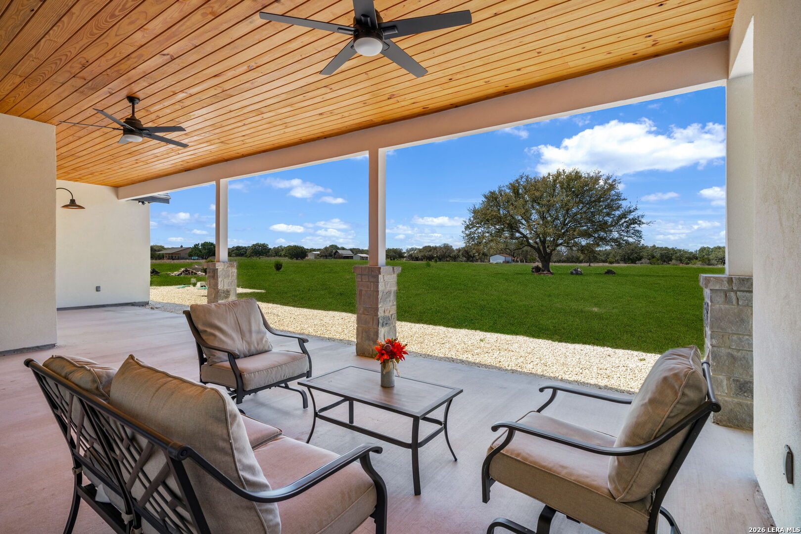 344 Buckskin Trail Bandera, TX 78003 - Photo 37 of 50 a view of a patio with a table chairs and a patio